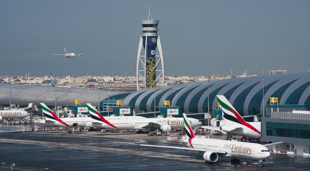 CORRECTS THE YEAR TO 2022, NOT 2021 - FILE - An Emirates jetliner comes in for landing at the Dubai International Airport in Dubai, United Arab Emirates, Dec. 11, 2019. Airlines across the world, including the long-haul carrier Emirates, rushed Wednesday, Jan. 19, 2022, to cancel or change flights heading into the U.S. over an ongoing dispute about the rollout of 5G mobile phone technology near American airports. (AP Photo/Jon Gambrell, File)