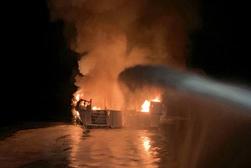 FILE - In this Sept. 2, 2019, file photo, provided by the Ventura County Fire Department, VCFD firefighters respond to a fire aboard the Conception dive boat fire in the Santa Barbara Channel off the coast of Southern California. The Coast Guard has announced several new safety rules following the deadly blaze that sent dozens of people on a scuba diving boat to a watery grave off the California coast more than two years ago. (Ventura County Fire Department via AP, File)
