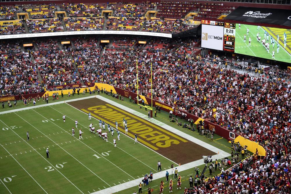 Fans watch as the Washington Commanders face the Jacksonville Jaguars in an NFL football game, Sunday, Sept. 11, 2022, in Landover, Md. The Washington Commanders have been sued again by the District of Columbia, this time accused of scheming to cheat fans out of ticket money. D.C. Attorney General Karl A. Racine on Thursday, Nov. 17, 2022, announced the filing of a lawsuit in civil court against the NFL team for the team's actions in taking season-ticket holder money and keeping it for its own purposes. (AP Photo/Nick Wass, File)