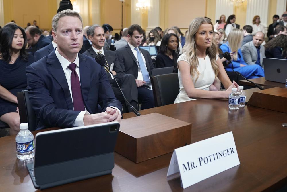 Matt Pottinger, former deputy national security adviser, and Sarah Matthews, former White House deputy press secretary, return from a break as they testify as the House select committee investigating the Jan. 6 attack on the U.S. Capitol holds a hearing at the Capitol in Washington, Thursday, July 21, 2022. (AP Photo/Patrick Semansky)