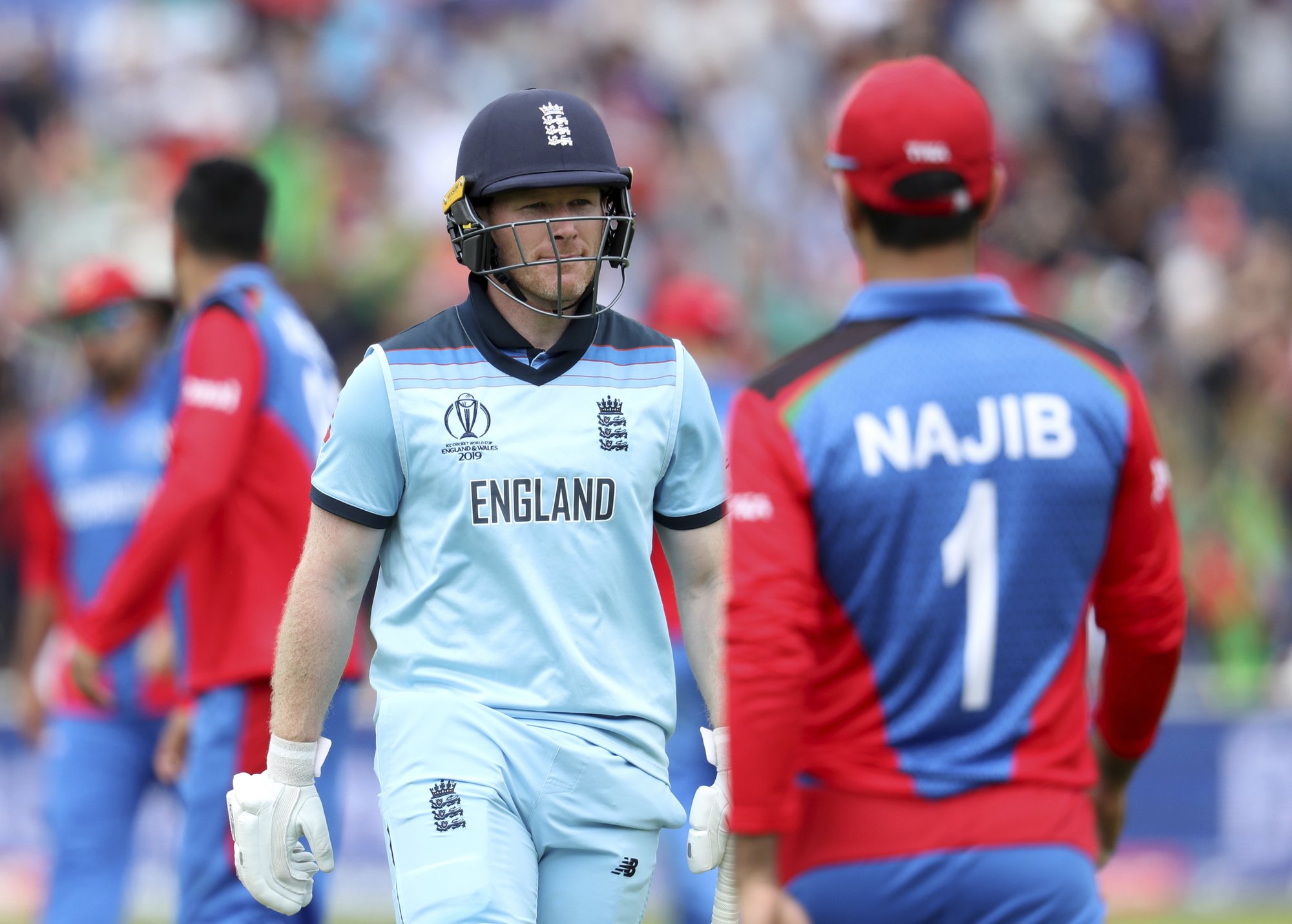 The Latest: Morgan, England set records in World Cup win