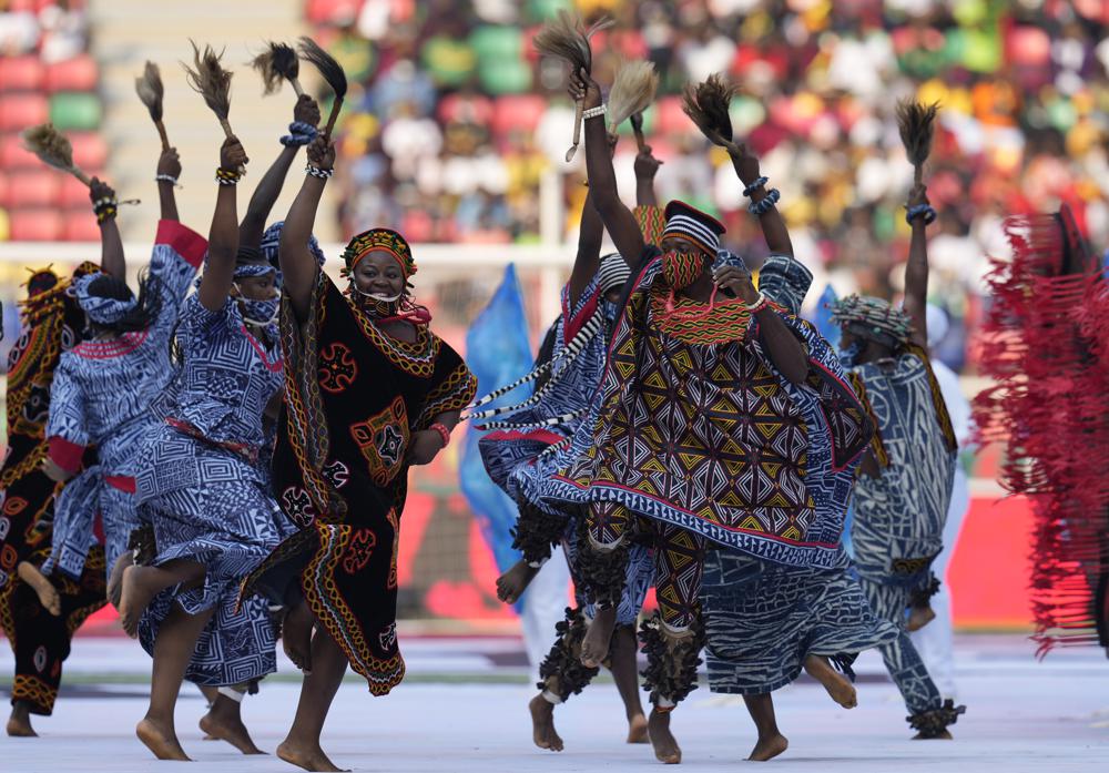 Traditional dancers perform during opening ceremony of the African Cup of Nations 2022 group A soccer match between Cameroon and Burkina Faso at the Olembe stadium in Yaounde, Cameroon, Sunday, Jan. 9, 2022. (AP Photo/Themba Hadebe)