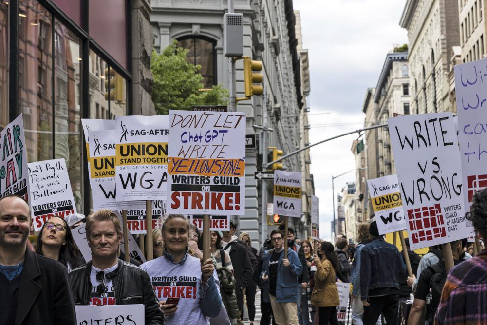 Members of the Writers Guild of America union picket outside Netflix headquarters near Union Square, Wednesday, May 3, 2023, in New York. (AP Photo/Stefan Jeremiah)