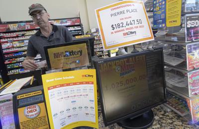 Bruce Gideos, manager at Pierre's Place, in Chesterfield, N.H., prints out Mega Millions tickets on Wednesday, July 27, 2022. The Mega Millions jackpot has topped $1 billion before Friday's drawing. (Kristopher Radder/The Brattleboro Reformer via AP)