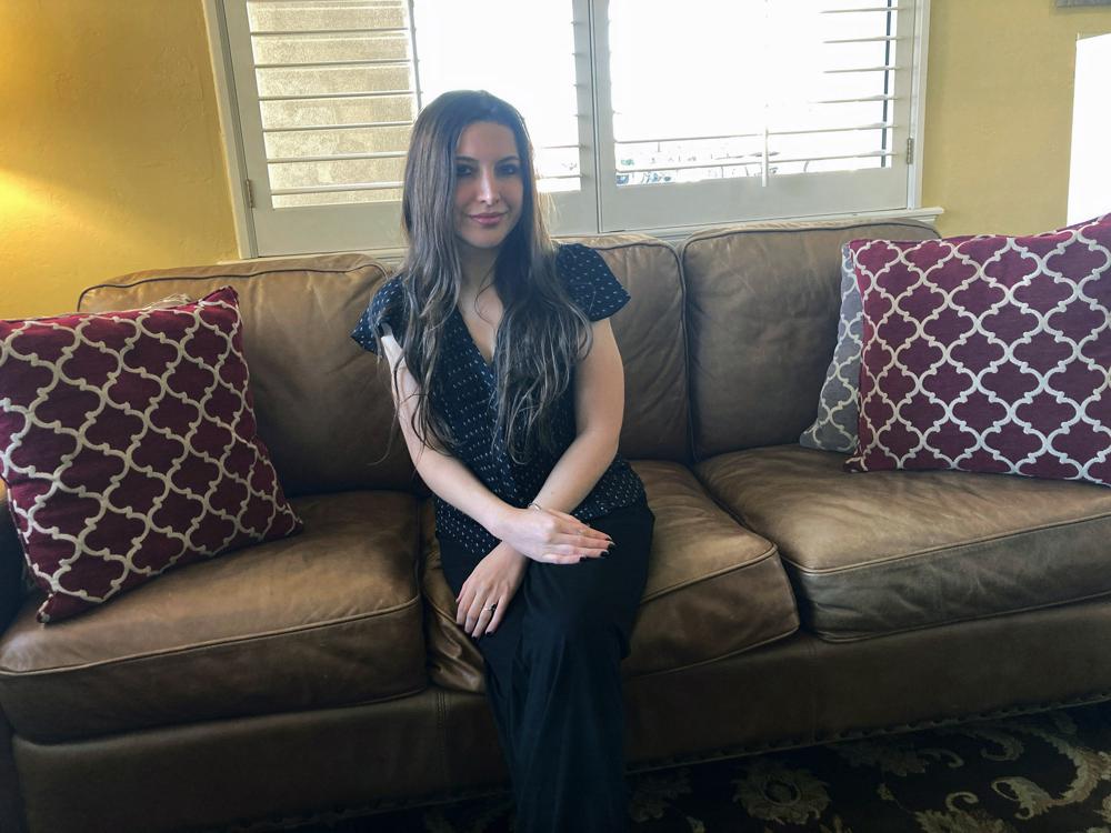 Lea Rodger, 32, poses for a photo on March 28, 2022, in McAlester, Okla., the day before she married Oklahoma death row-inmate Richard Glossip, at the Oklahoma State Penitentiary. Glossip has tied the knot in prison for the second time. Glossip, who was convicted of a 1997 murder-for-hire married fiance Lea Rodger on Tuesday, March 29, 2022, inside the state penitentiary in McAlester. (AP Photo/Sean Murphy)