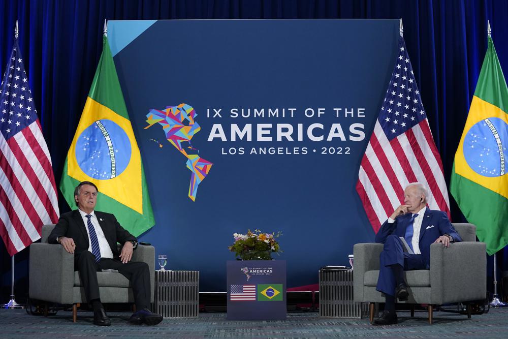 President Joe Biden, right, meets with Brazilian President Jair Bolsonaro during the Summit of the Americas, Thursday, June 9, 2022, in Los Angeles. (AP Photo/Evan Vucci)