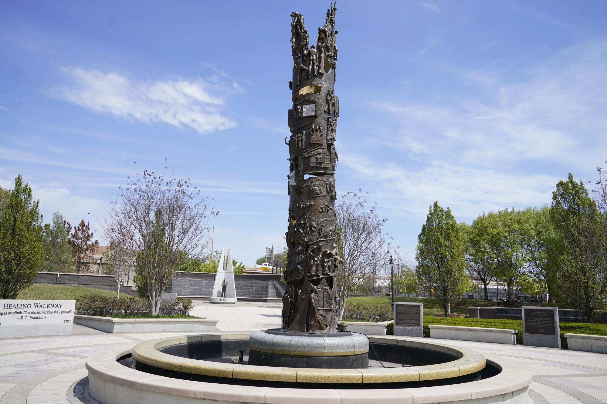 A sculpture in John Hope Franklin Reconciliation Park is pictured Wednesday, April 14, 2021, in Tulsa, Okla. (AP Photo/Sue Ogrocki)