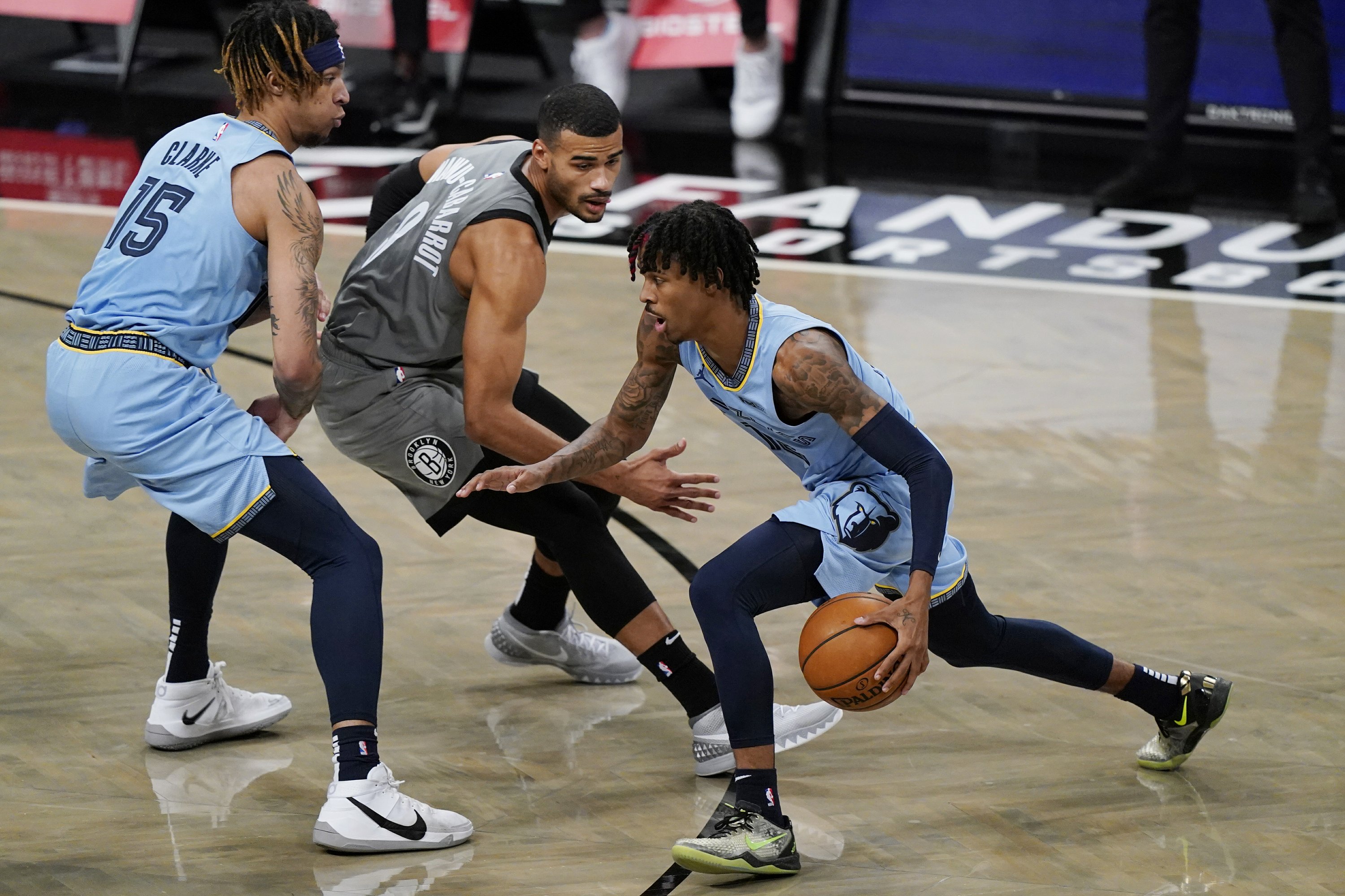 NEW YORK (AP) - Rookie of the Year Ja Morant left the court area in a wheel...