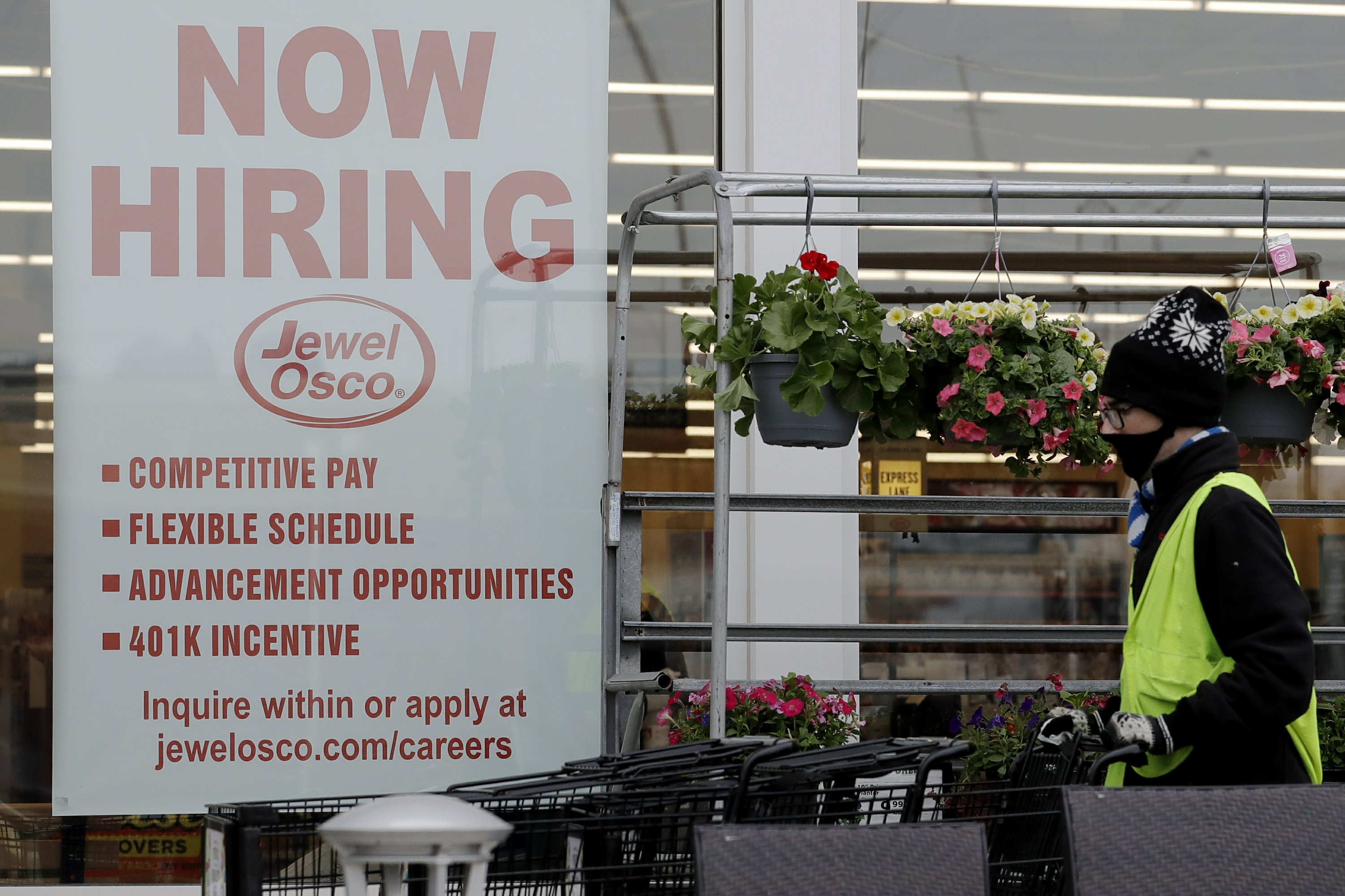 Gripped by surging pandemic, US employers cut back on hiring