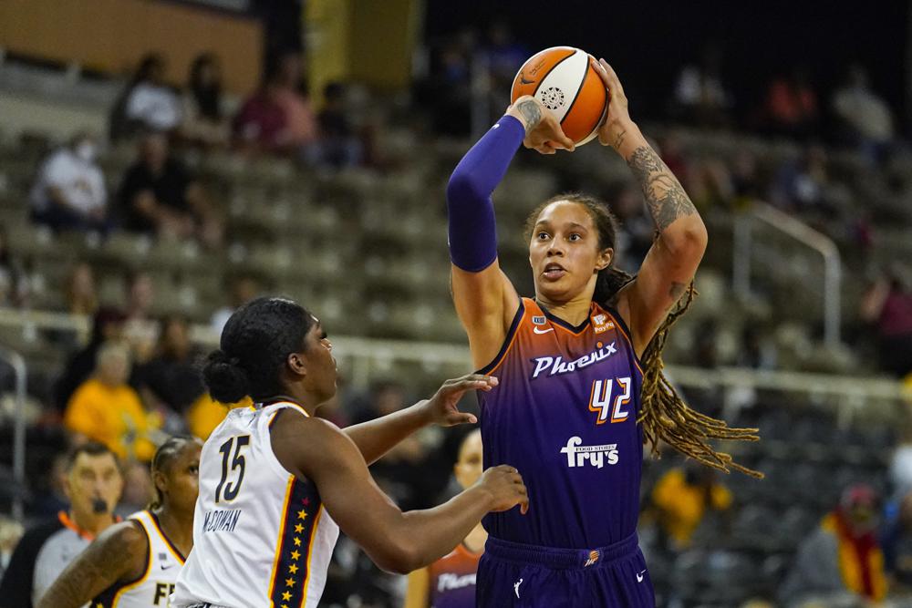 FILE - Phoenix Mercury center Brittney Griner (42) shoots over Indiana Fever forward Teaira McCowan (15) in the first half of a WNBA basketball game in Indianapolis, Monday, Sept. 6, 2021. The United States stepped up its push Friday, March 18, 2022, for consular access to Brittney Griner, the WNBA star who is detained in Russia on allegations of drug smuggling, as a member of a Russian state-backed prison monitoring group said Griner was faring well behind bars. (AP Photo/Michael Conroy, File)