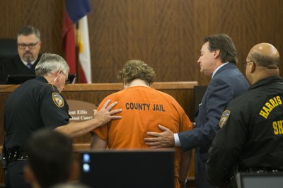 Texas shooting suspect collapses twice in court | AP News