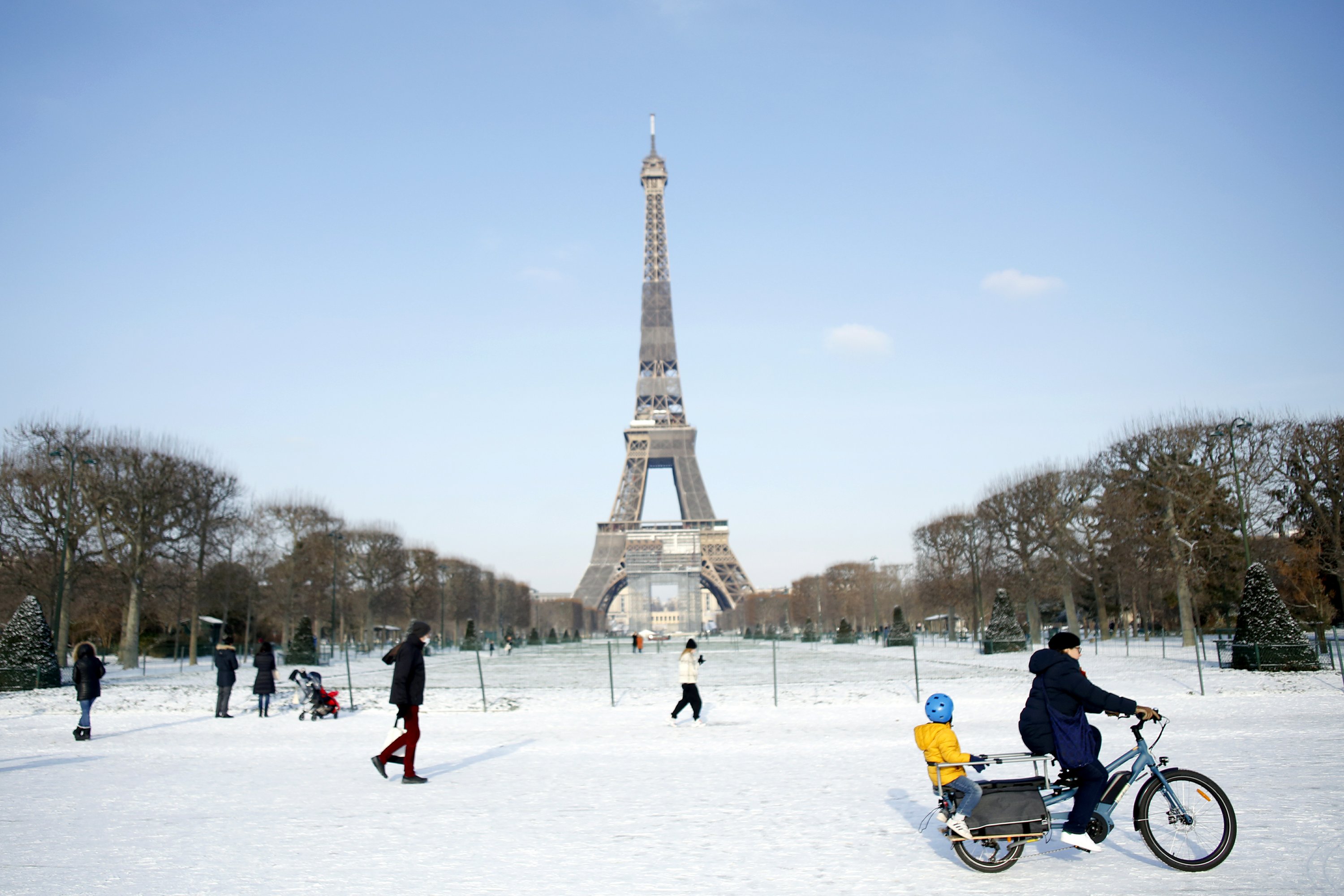 Eiffel Tower needs torch for ice while snow covers Europe