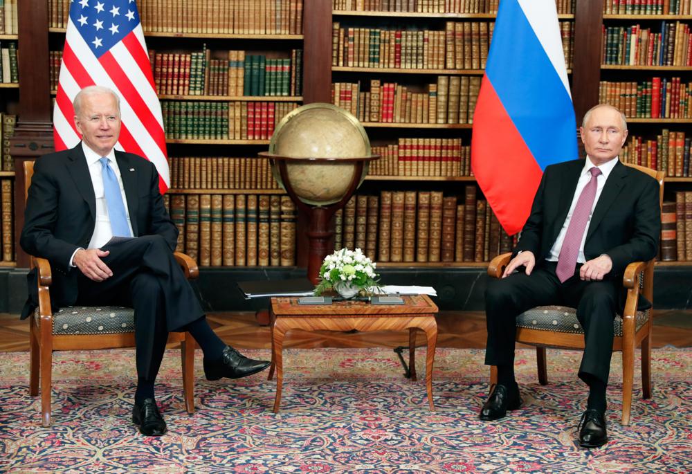 U.S President Joe Biden, left, and Russian President Vladimir Putin pose for media during their meeting at the 'Villa la Grange' in Geneva, Switzerland in Geneva, Switzerland, Wednesday, June 16, 2021. (Mikhail Metzel/Pool Photo via AP)