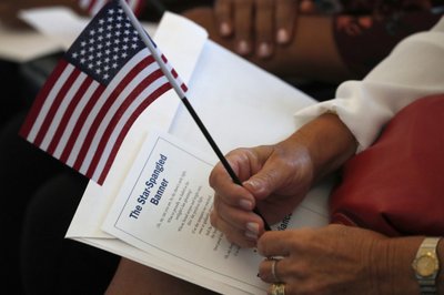 Census figures show economic gap narrows with citizenship | AP News