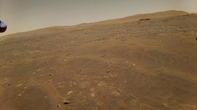 Esta fotografía del 22 de mayo de 2021 facilitada por la NASA muestra la superficie de Marte tomada por el helicóptero Ingenuity a 10 metros (33 pies) de altura en su sexto vuelo sobre el planeta rojo. (NASA/JPL-Caltech vía AP)