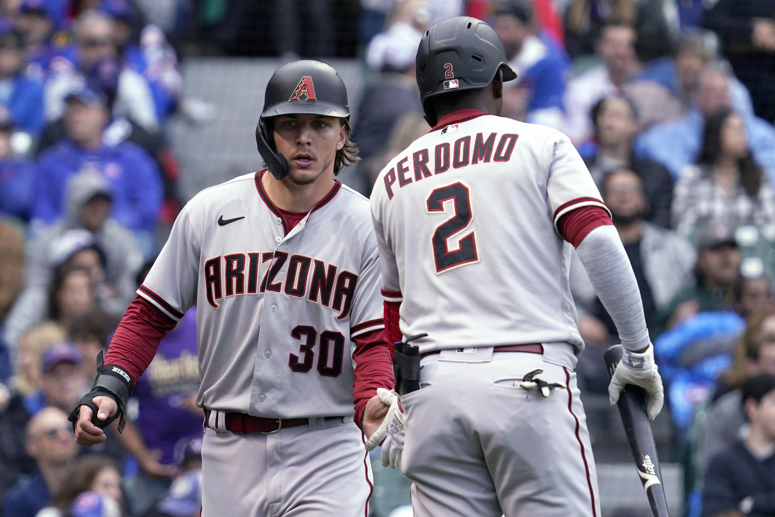 Varsho's double scores 3 in 10th in Dbacks' 76 win vs Cubs AP News