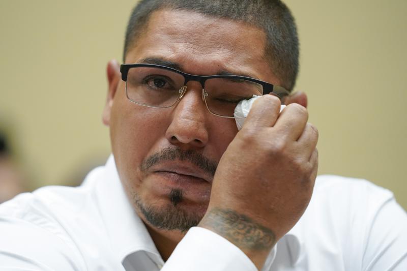 Miguel Cerrillo, father of Miah Cerrillo a fourth grade student at Robb Elementary School in Uvalde, Texas, wipes his eye as he testifies during a House Committee on Oversight and Reform hearing on gun violence on Capitol Hill in Washington, Wednesday, June 8, 2022. (AP Photo/Andrew Harnik, Pool)