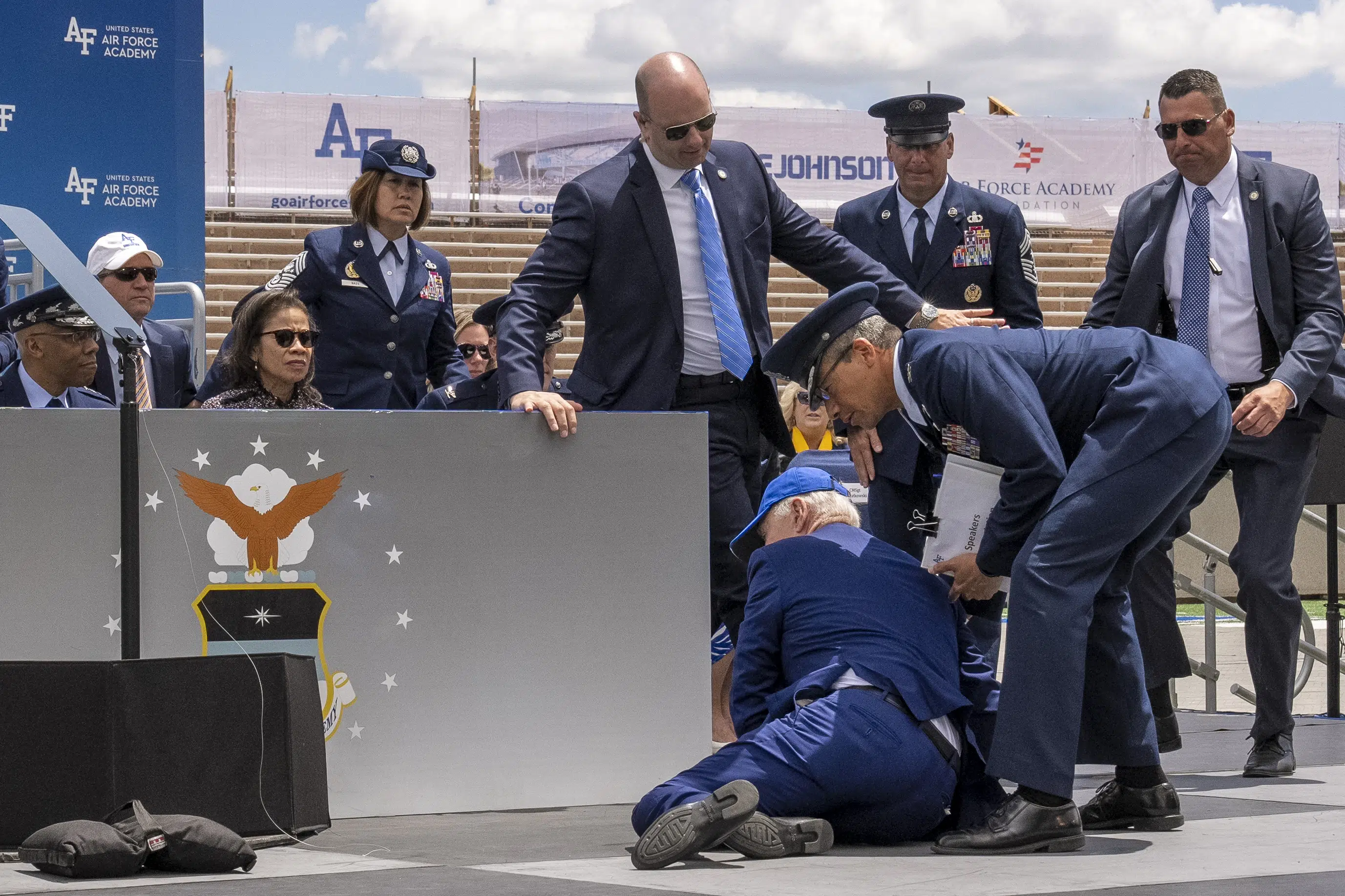 Biden trips and falls on stage at Air Force graduation; White House says he’s ‘fine’