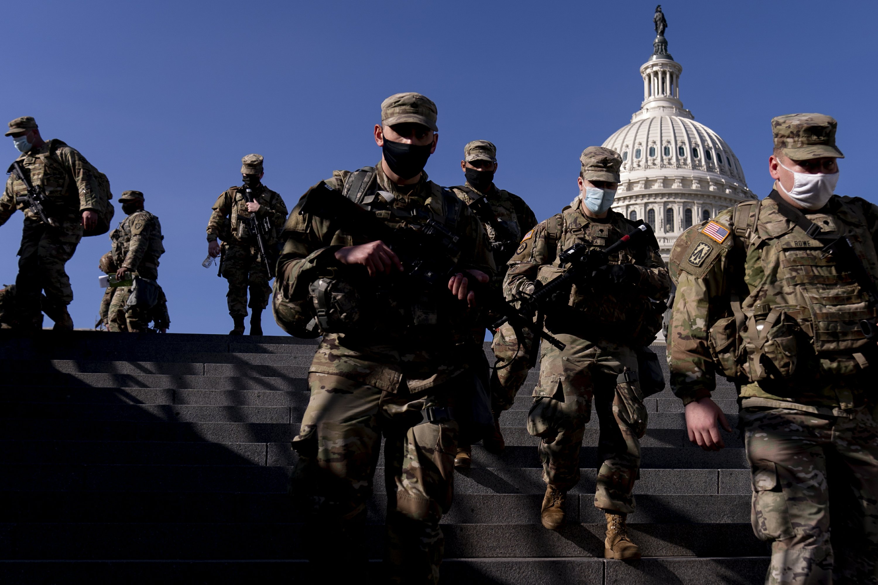 Troops of the National Guard pour in as Washington locks up