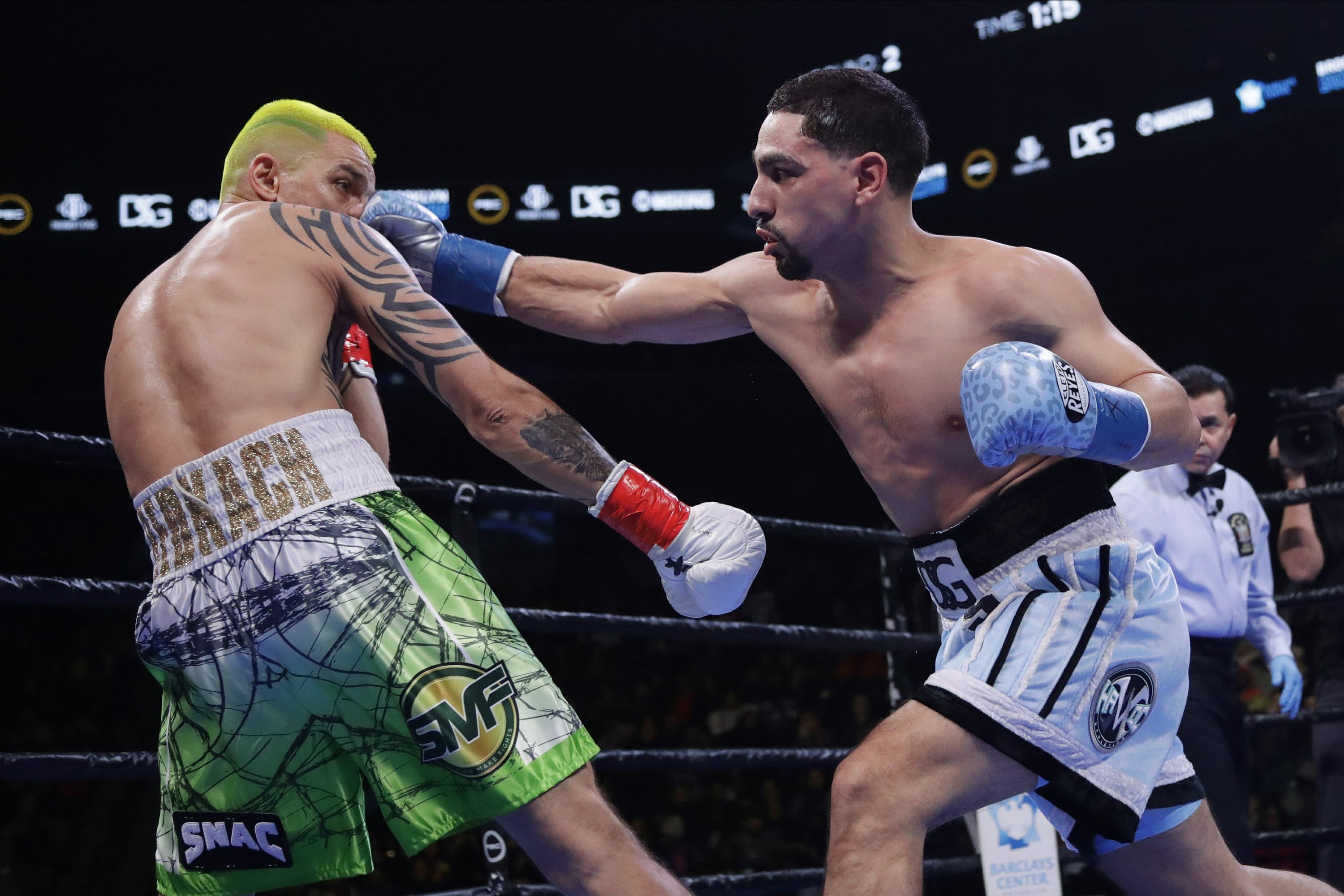 Garcia earns 12-round decision, overcomes bite by Redkach