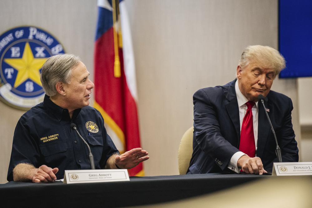 TRUMP AT THE BORDER 6 Texas Gov. Greg Abbott addresses former President Donald Trump during a border security briefing to discuss further plans in securing the southern border wall on Wednesday, June 30, 2021, in Weslaco, Texas. (Brandon Bell/Pool via AP)