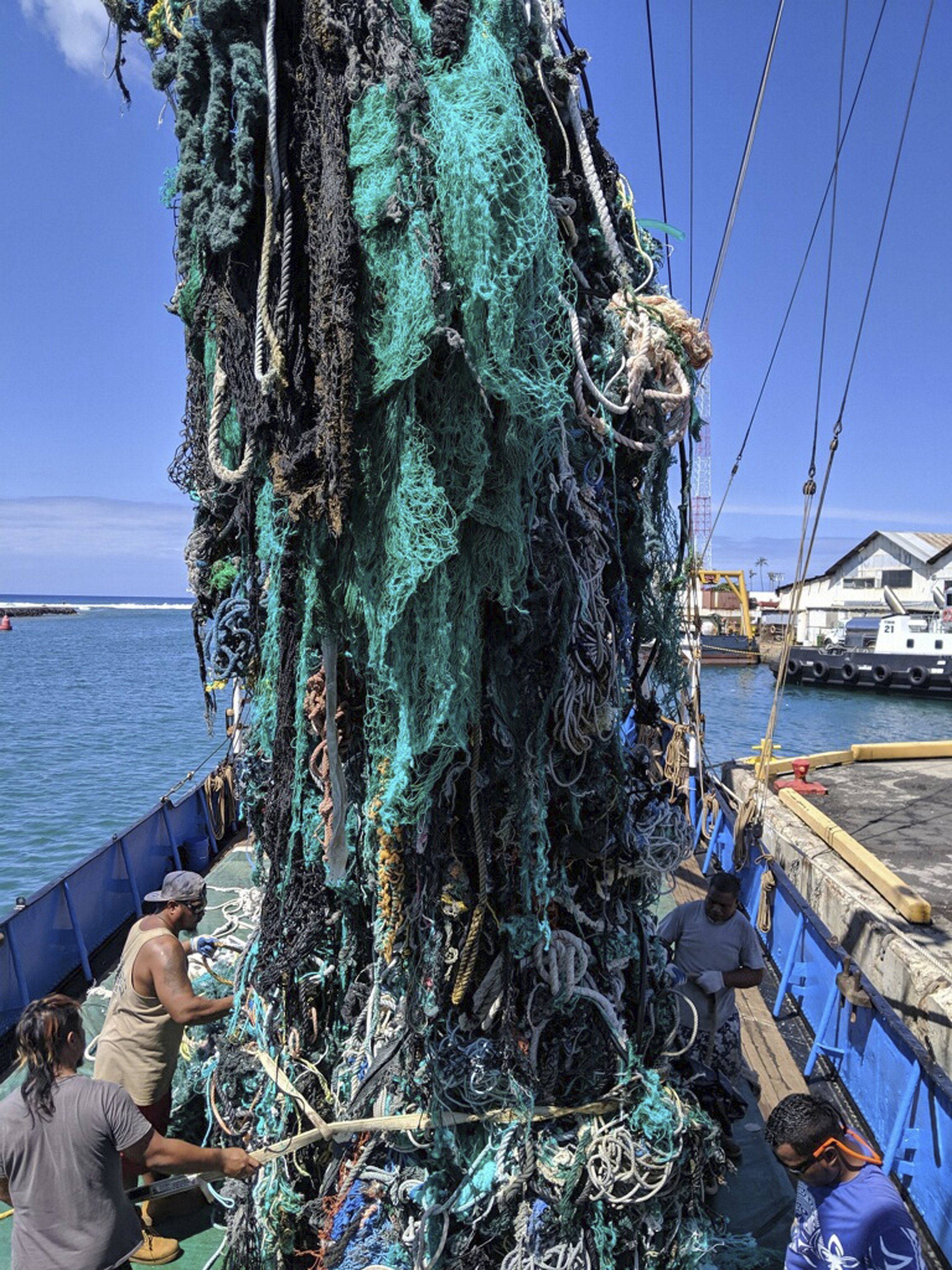 Stock photo of A tangle of fishing nets, lines, hooks and other garbage  found floating in…. Available for sale on