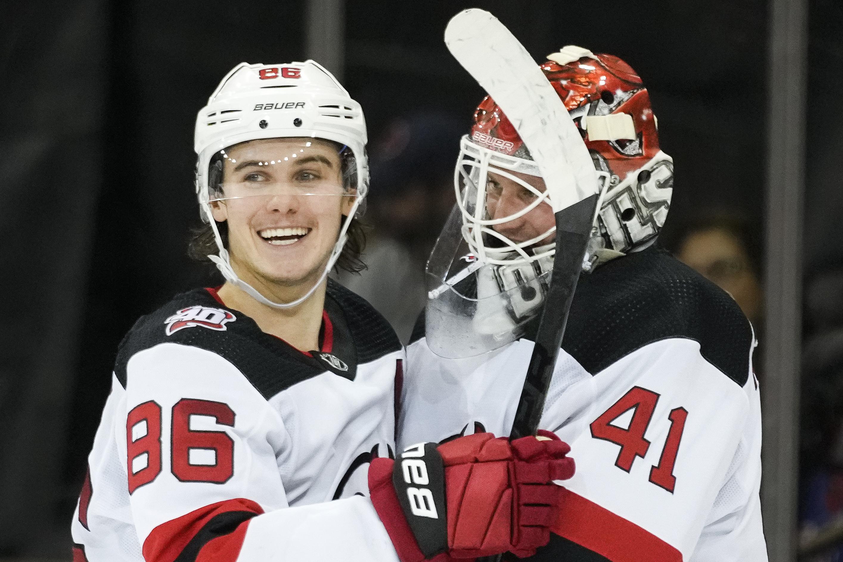 Devils rally from two goals down to beat Rangers 5-3 | AP News