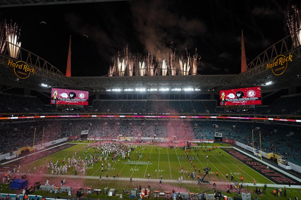 FILE - Alabama celebrates after their win against Ohio State in an NCAA College Football Playoff national championship game, Monday, Jan. 11, 2021, in Miami Gardens, Fla. College football and men's basketball players on scholarship in one of the major conferences can expect to soon earn a minimum of $50,000 each year he plays because of the influx of cash from so-called booster collectives brokering name, image and likeness deals.That prediction, based on market trends, was made this week by Blake Lawrence, co-founder and CEO of a company that helps athletes and schools navigate the ever-changing NIL landscape. (AP Photo/Wilfredo Lee)