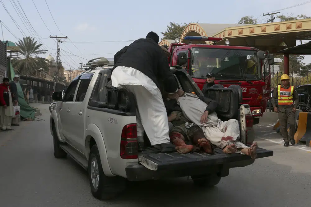 Injured victims of a suicide bombing are transported toward a hospital in Peshawar, Pakistan, Monday, Jan. 30, 2023. A suicide bomber struck Monday inside a mosque in the northwestern Pakistani city of Peshawar, killing multiple people and wounding more worshippers, officials said. (AP Photo/Muhammad Sajjad)