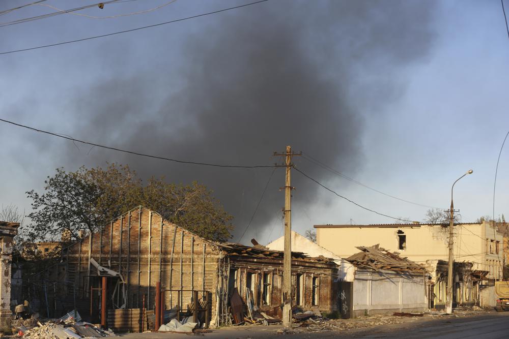 Smoke rises over a district near the Metallurgical Combine Azovstal in Mariupol during shelling, in Mariupol, in territory under the government of the Donetsk People's Republic, eastern Ukraine, Saturday, May 7, 2022. (AP Photo/Alexei Alexandrov)