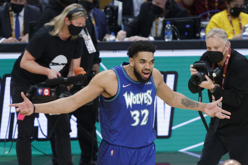 Minnesota Timberwolves' Karl-Anthony Towns celebrates after winning the three-point shot skills challenge competition, part of NBA All-Star basketball game weekend, Saturday, Feb. 19, 2022, in Cleveland. (AP Photo/Ron Schwane)