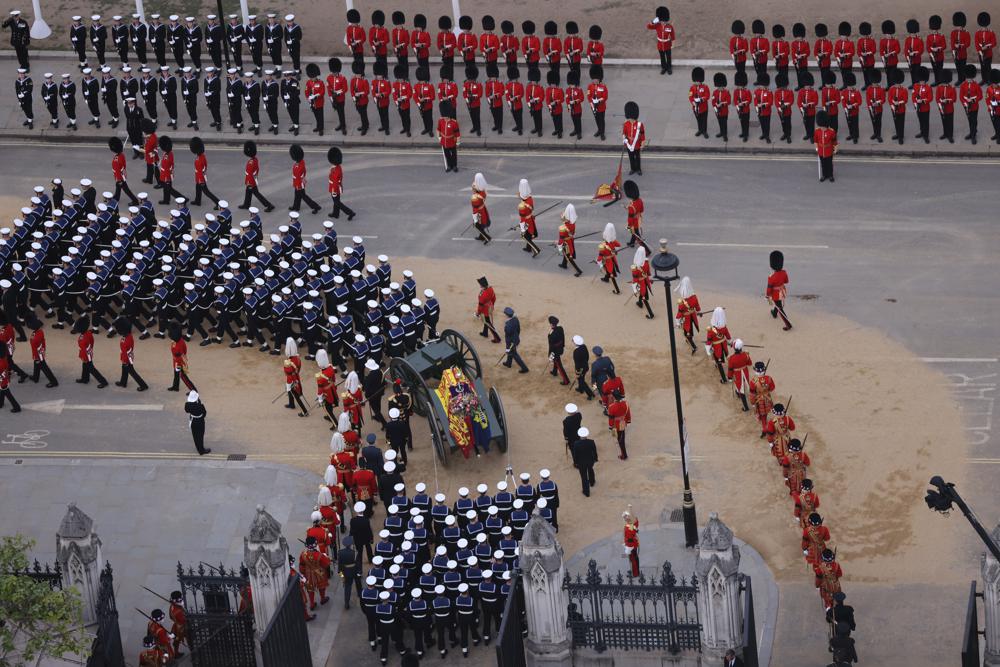 Members of the armed forces march during the funeral procession for Queen Elizabeth II in London, Monday, Sept. 19, 2022. (Rupert Frere/Ministry of Defence via AP)