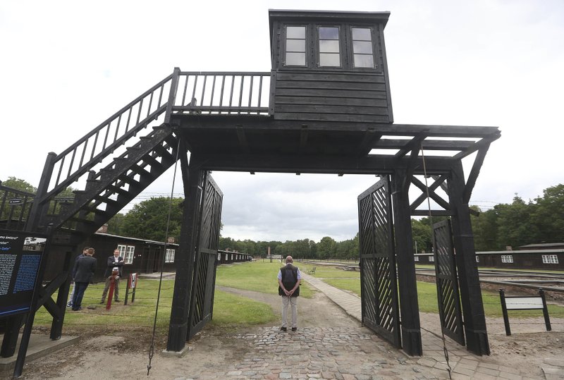 FILE - In this July 18, 2017 file photo, the wooden main gate leads into the former Nazi German Stutthof concentration camp in Sztutowo, Poland. (AP Photo/Czarek Sokolowski, file)