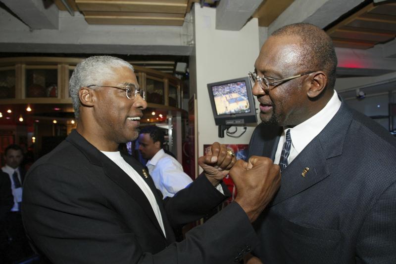 FILE -NBA legend Julius 'Dr. J' Erving, left, greets former Milwaukee Bucks' Bob Lanier during LeBron James presentation for the NBA Rookie of the Year award at the NBA Store on New York's 5th Avenue, Tuesday, April 20, 2004. Bob Lanier, the left-handed big man who muscled up beside the likes of Kareem Abdul-Jabbar as one of the NBA’s top players of the 1970s, died Tuesday, May 10, 2022. He was 73.(AP Photo/Stuart Ramson, File)