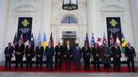 FILE - President Joe Biden, center, poses for a photo with Pacific Island leaders on the North Portico of the White House in Washington, Sept. 29, 2022. From left, New Caledonia President Louis Mapou, Tonga Prime Minister Siaosi Sovaleni, Palau President Surangel Whipps Jr., Tuvalu Prime Minister Kausea Natano, Micronesia President David Panuelo, Fiji Prime Minister Josaia Voreqe Bainimarama, Biden, Solomon Islands Prime Minister Manasseh Sogavare, Papua New Guinea Prime Minister James Marape, Marshall Islands President David Kabua, Samoa Prime Minister Fiame Naomi Mata'afa, French Polynesia President Edouard Fritch and Cook Islands Prime Minister Mark Brown. (AP Photo/Susan Walsh, File)