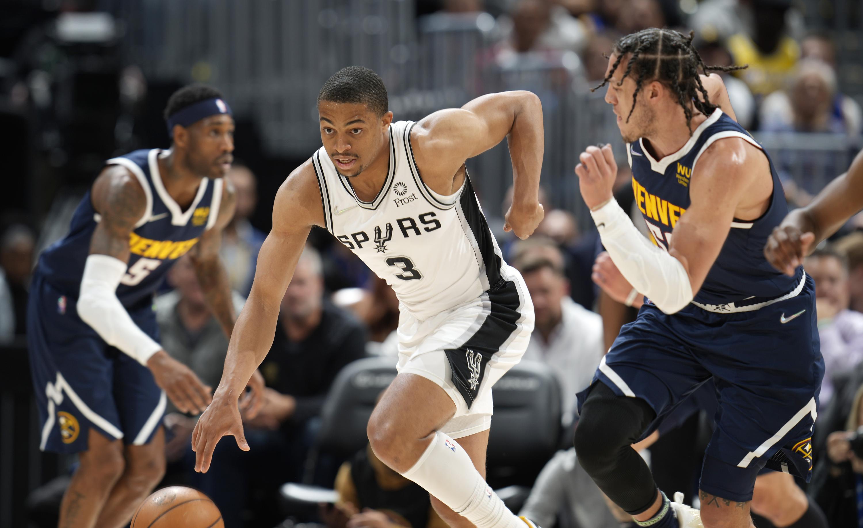 Spurs beat Nuggets 11697, earn spot in playin tournament AP News