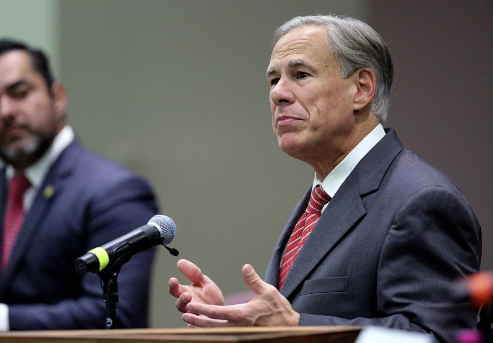 Texas Gov. Greg Abbott speaks before he signs Texas SB 576, an anti-smuggling bill that enhances the criminal penalty for human smuggling when a payment is involved, at McAllen City Hall on Wednesday, Sept. 22, 2021, in McAllen, Texas. (Joel Marinez/The Monitor via AP)