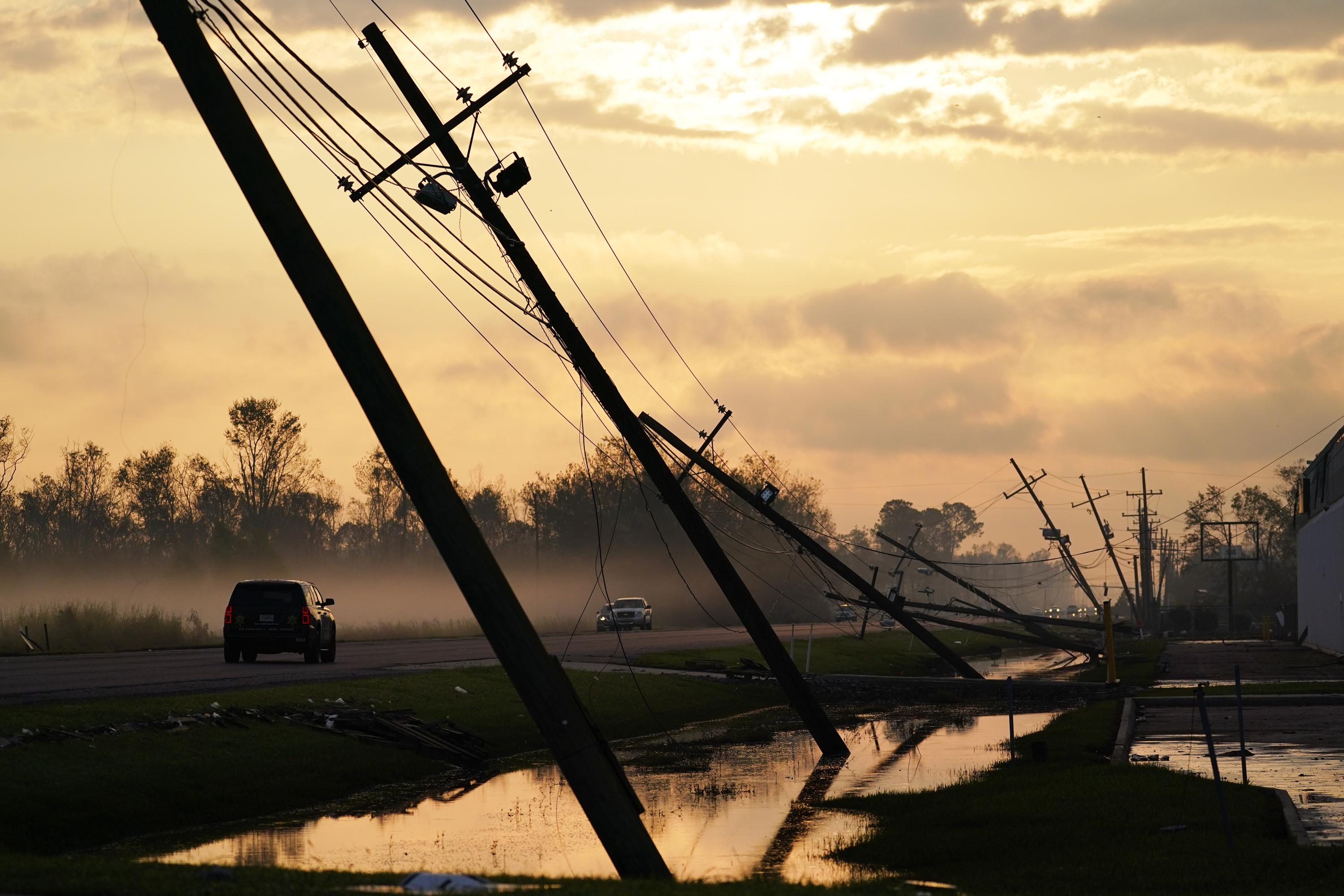 Storms batter aging power grid as climate disasters spread | AP News