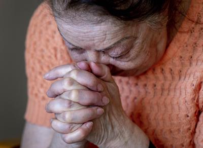 Ukrainian Holocaust survivor Tatyana Zhuravliova reacts during an AP interview in an old people's home in Frankfurt, Germany, Sunday, March 27, 2022. As the war in Ukraine continues to get more brutal, Jewish organizations are trying to evacuate as many of the 10,000 Holocaust survivors living there as possible. (AP Photo/Michael Probst)