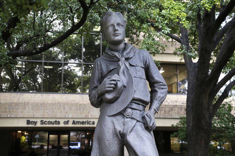 FILE - In this Feb. 12, 2020 file photo, a statue stands outside the Boy Scouts of America headquarters in Irving, Texas. The Boy Scouts of America have reached an agreement with attorneys representing some 60,000 victims of child sex abuse in what could prove to be a pivotal moment in the organization’s bankruptcy case. Attorneys for the BSA filed court papers late Thursday, July 1, 2021 outlining a restructuring support agreement, or RSA, with attorneys representing abuse victims. (AP Photo/LM Otero, File)