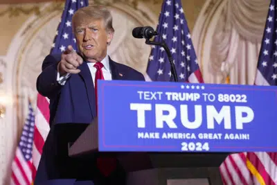 FILE - Former President Donald Trump gestures as he announces he is running for president for the third time as he speaks at Mar-a-Lago in Palm Beach, Nov. 15, 2022. Trump is facing a new legal threat, but there is little sign that the Republican Party is defending the former president with the same intensity and urgency that defined his previous legal clashes. (AP Photo/Andrew Harnik, File)