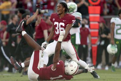 Stanford players celebrate after upsetting No. 3 (at the time) Oregon 31-24 in OT