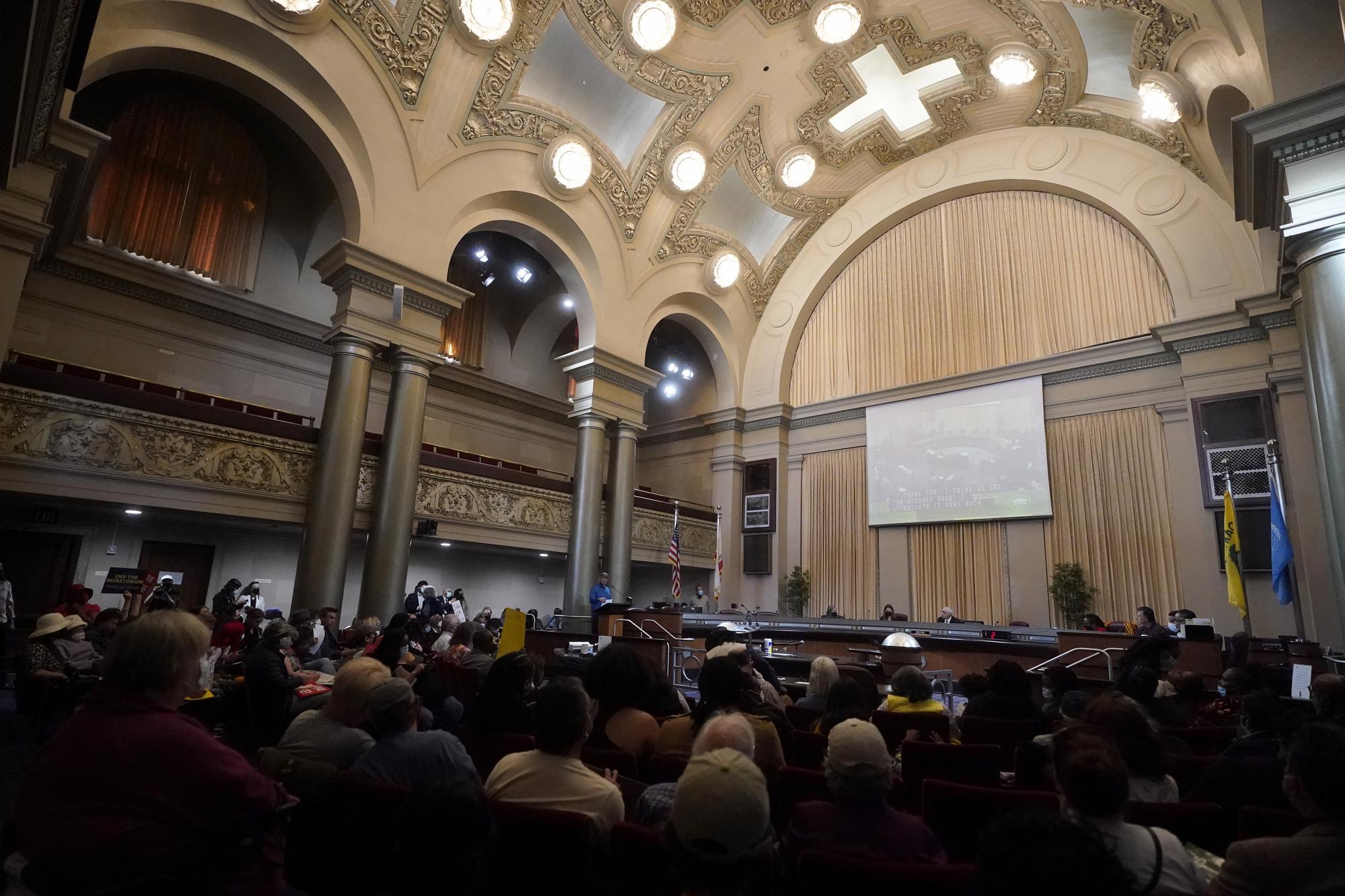 People take part in a Oakland City Council special community and economic development committee at City Hall in Oakland, Calif., Tuesday, April 11, 2023. Earlier this year, small property landlords took to City Hall to demand an end to the eviction ban. They said they were going into debt or facing foreclosure while tenants with jobs skipped out on rent. (AP Photo/Jeff Chiu)