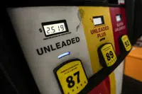 FILE - Gas pumps are shown Monday, Dec. 12, 2022, in Madison, Ga. Drivers in the U.S. and Europe are getting a break from the record-high pump prices they endured over the summer. But that price tag is still difficult for many customers who have been enduring relentless inflation and were used to lower prices. (AP Photo/John Bazemore, File)