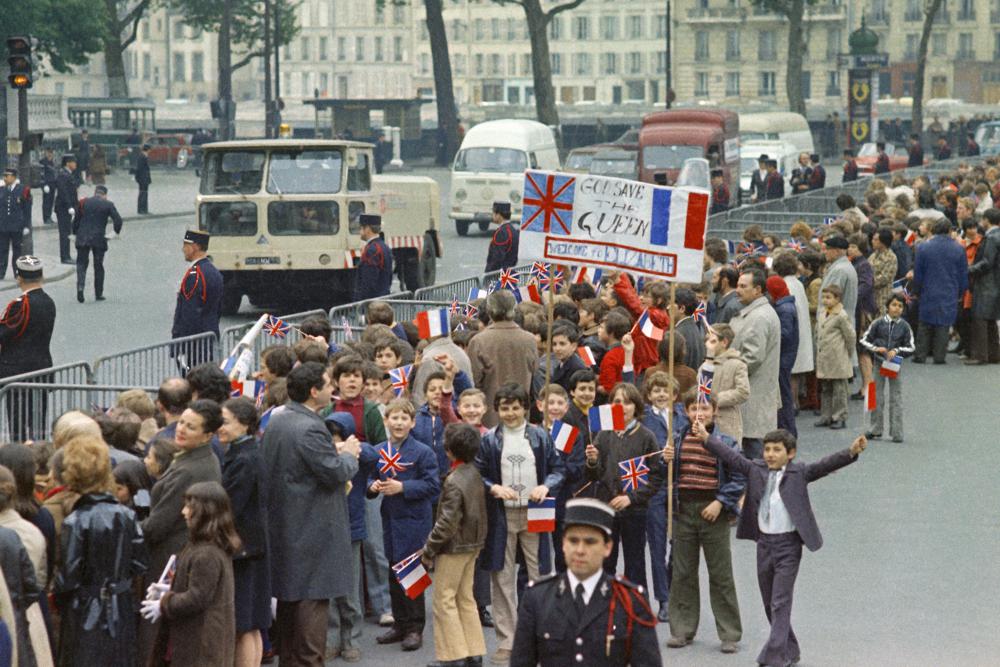 Young French schoolchildren wait to greet Britains Queen Elizabeth II, when she arrives in Paris, at the start of a four day official visit to France, Paris, on May 15, 1972. (Photo: AP)