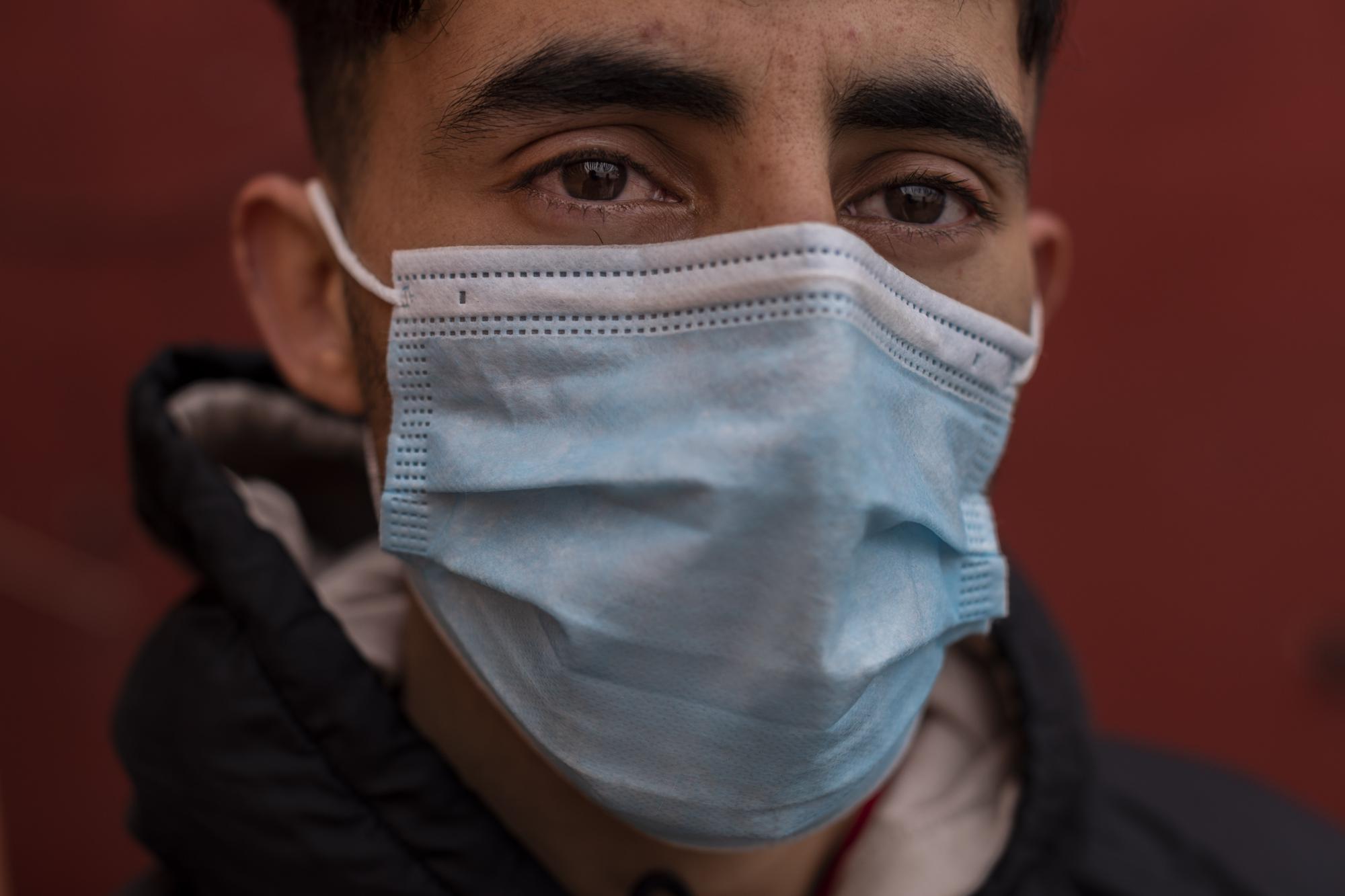 A migrant who crossed into Spain on Monday, in the enclave of Ceuta, next to the border of Morocco and Spain, Thursday, May 20, 2021. (AP Photo/Bernat Armangue)