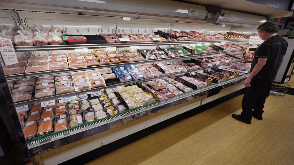 A man looks at beef in the meat department at Lambert's Rainbow Market, on June 15, 2021 in Westwood, Mass. The Labor Department said Thursday, Feb. 10, 2022, that consumer prices jumped 7.5% last month compared with a year earlier, the steepest year-over-year increase since February 1982. The acceleration of prices ranged across the economy, from food and furniture to apartment rents, airline fares and electricity. (AP Photo/Charles Krupa)