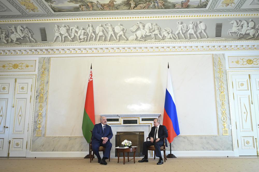 Russian President Vladimir Putin, right, talks with Belarusian President Alexander Lukashenko during their meeting in St. Petersburg, Russia, Tuesday, July 13, 2021. (Alexei Nikolsky, Sputnik, Kremlin Pool Photo via AP)