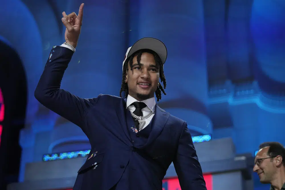 Ohio State quarterback C.J. Stroud reacts after being chosen by the Houston Texans with the second overall pick during the first round of the NFL football draft, Thursday, April 27, 2023, in Kansas City, Mo. (AP Photo/Jeff Roberson)