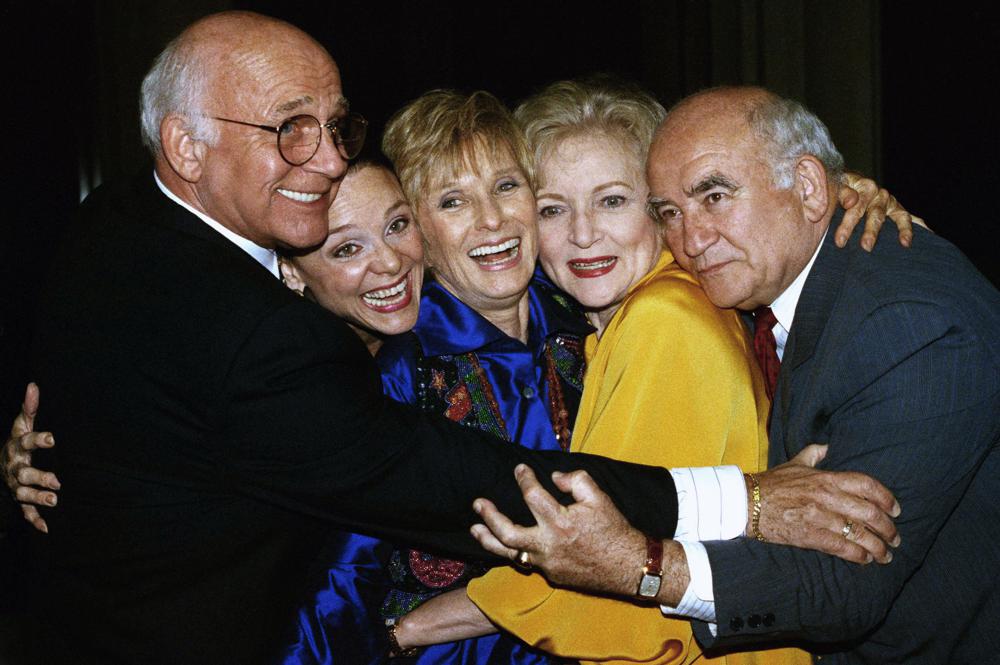 FILE - Former cast members of the Mary Tyler Moore Show, sans Mary Tyler Moore, are reunited for the Museum of Television and Radio's 9th annual Television Festival in Los Angeles on March 21, 1992. From left are Gavin MacLeod, Valerie Harper, Cloris Leachman, Betty White and Ed Asner. Betty White, whose saucy, up-for-anything charm made her a television mainstay for more than 60 years, has died. She was 99.   (AP Photo/Craig Fujii, File)